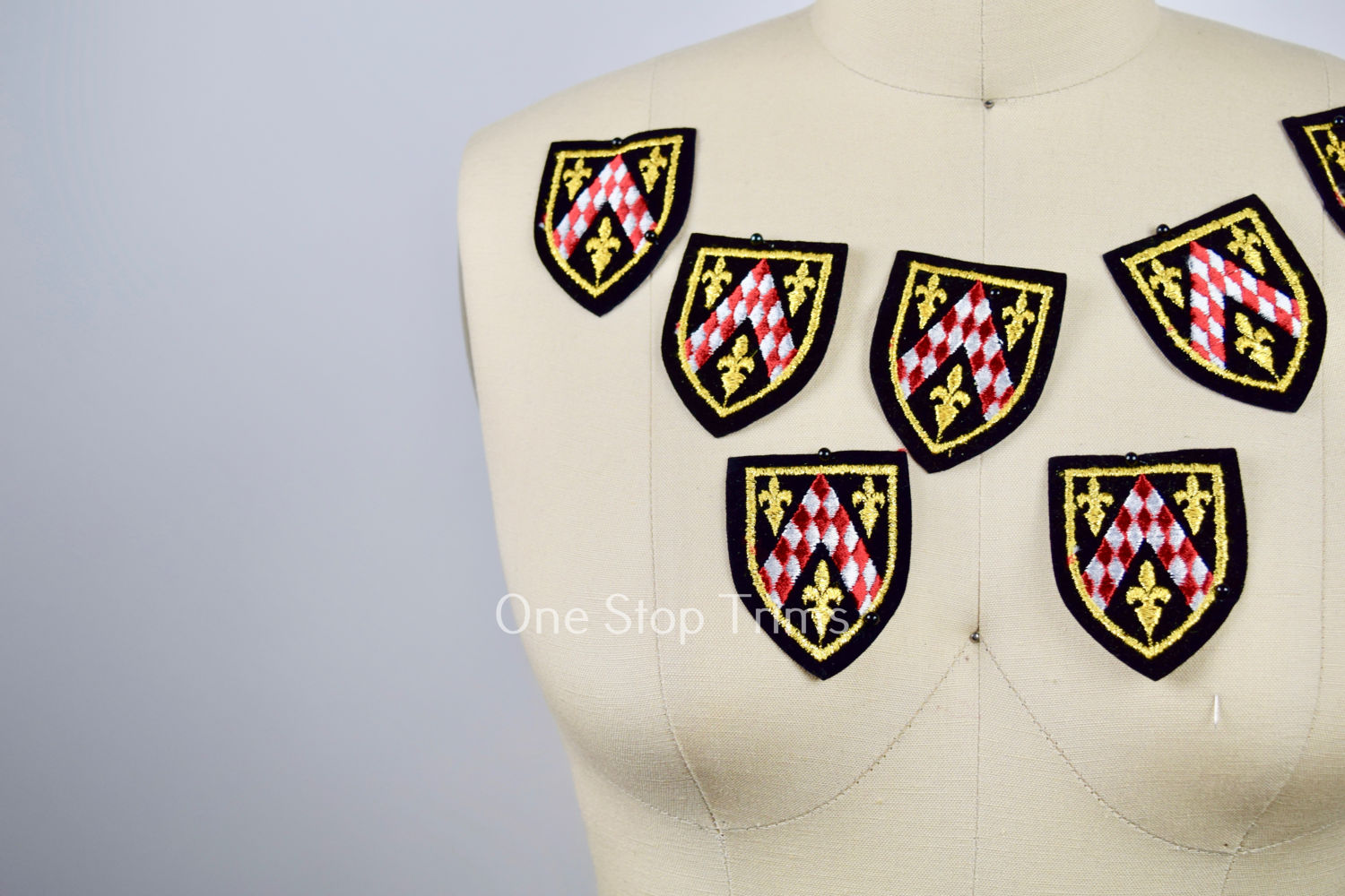 1 Black Gold Red and White Edgy Crests Set on Velvet Patch