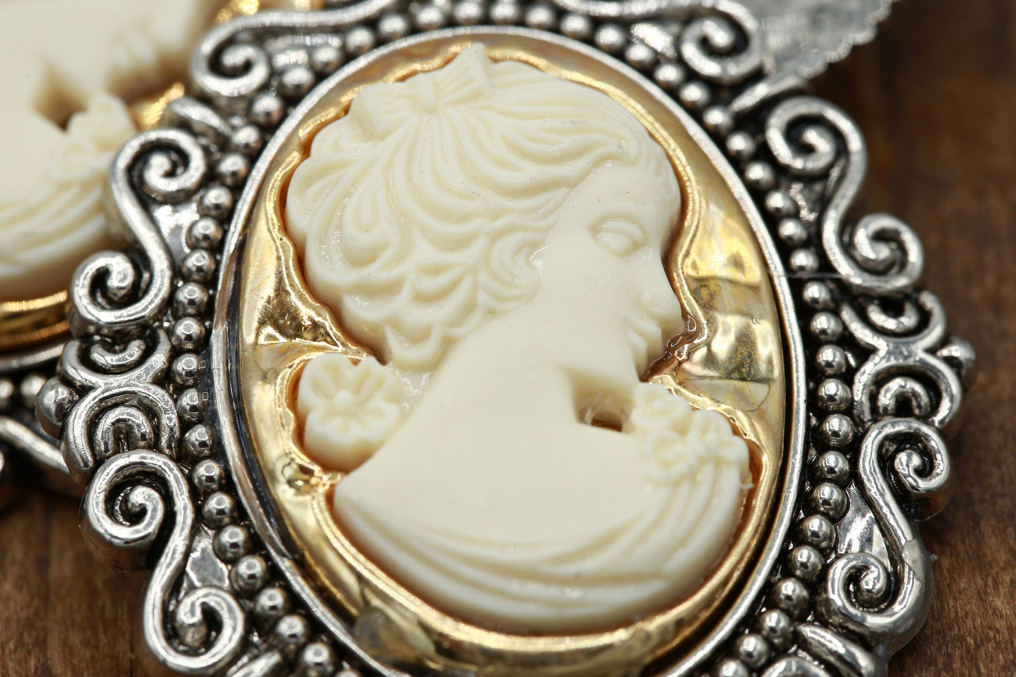 1 Ivory Face Gold Background Silver Frame Cameo Button