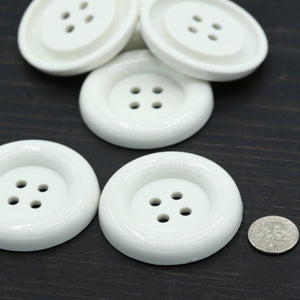 2 White Plastic Button